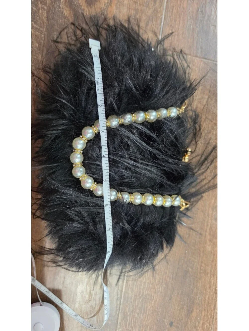Elegant Black Faux Fur Clutch Bag with Pearl Handle and Gold Frame